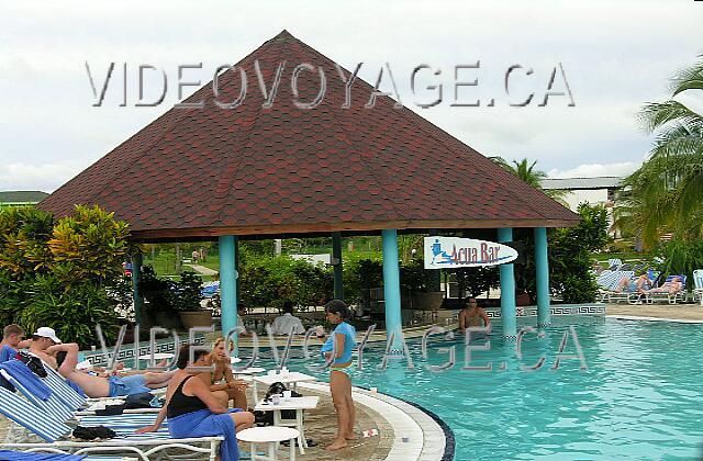 Cuba Guardalavaca Playa Costa Verde The pool bar with several seats in the pool and outside pool.