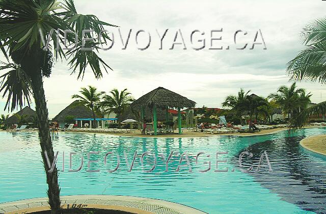 Cuba Guardalavaca Playa Pesquero A few palapas goshawks the pool.