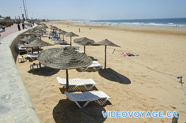 Maroc Agardir Atlas Amadil Beach Some chairs and palapas on the beach.