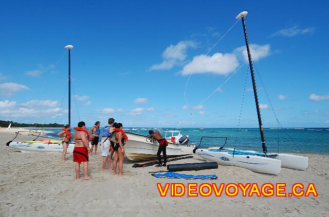 Republique Dominicaine Puerto Plata Iberostar Costa Dorada Sailboat and catamaran on the beach. Customers who prepares for the Banana boat.