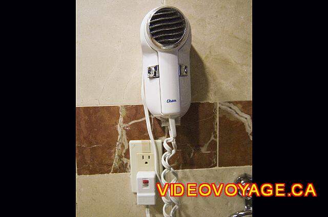 Republique Dominicaine Puerto Plata Viva Playa Dorada A hair dryer with a socket 110 Volts.