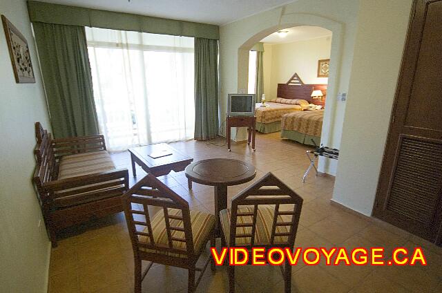 Republique Dominicaine Puerto Plata Viva Playa Dorada The living room with a table, sofa and balcony access.