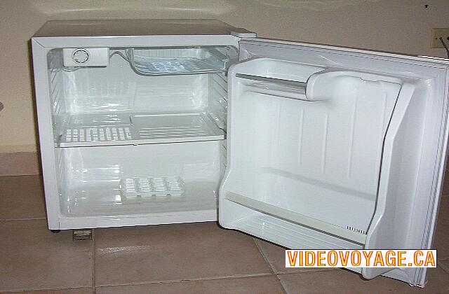 Cuba Santa Lucia Gran Club Santa Lucia A fridge with bottles of water. A mini top freezer.