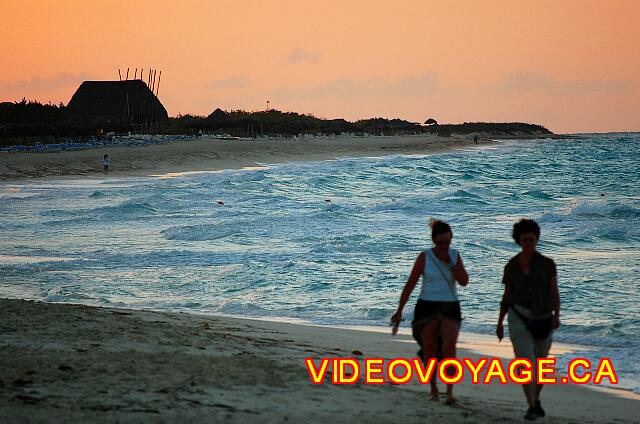 Cuba Cayo Santa Maria Melia Las Dunas Many walkers at sunset.