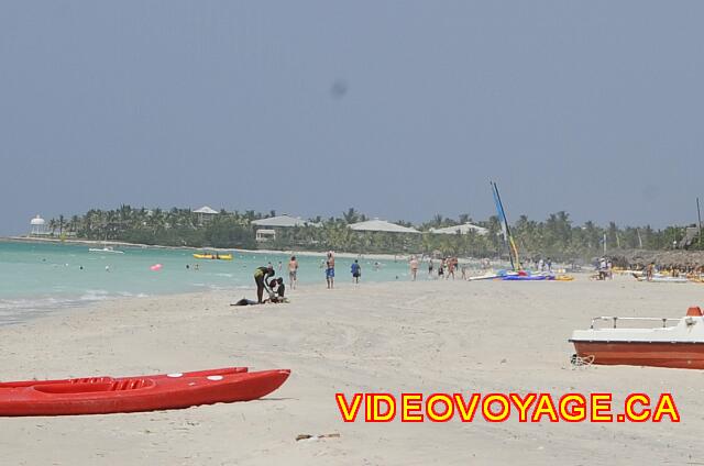 Cuba Varadero Club Amigo Aguas Azules Hotel Paradisus Varadero at the end. Some walkers on the beach ...