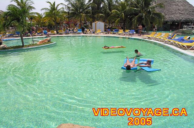 Cuba Varadero Royalton Hicacos Resort And Spa Lots of chairs, but no umbrellas, there are trees for shade in some places. The water is so clear! The carpet floats or flies?