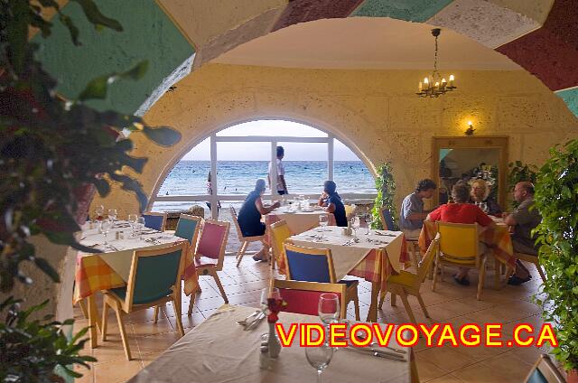 Cuba Varadero Hotel Club Kawama A table on the edge of the window with a view of the sunset.