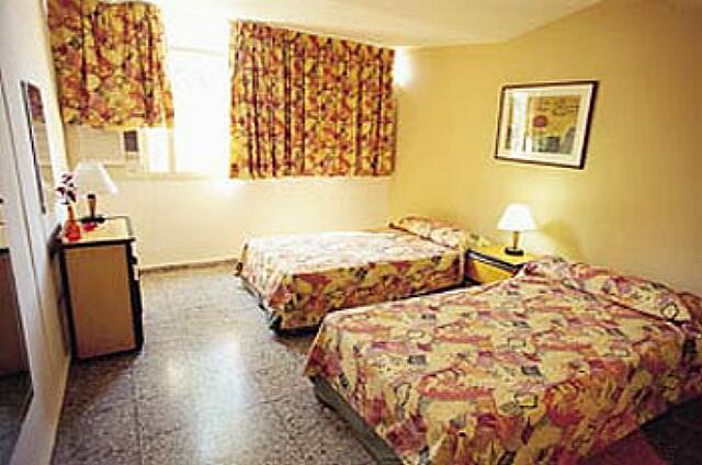 Cuba Varadero Mar del Sur A bedroom with two beds. A photograph of a few years.