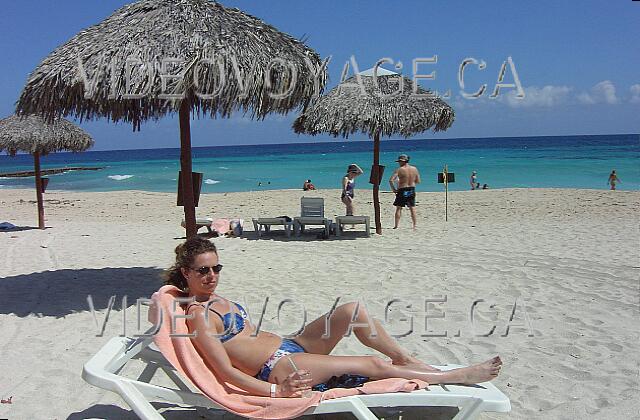 Cuba Varadero Oasis Islazul The beach is deep, many umbrellas and chairs. A bar near the beach.