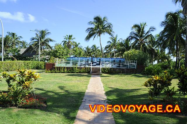 Cuba Varadero Bellevue Puntarena Playa Caleta Resort A gazebo surrounded by palm tree on the edge of the sea.